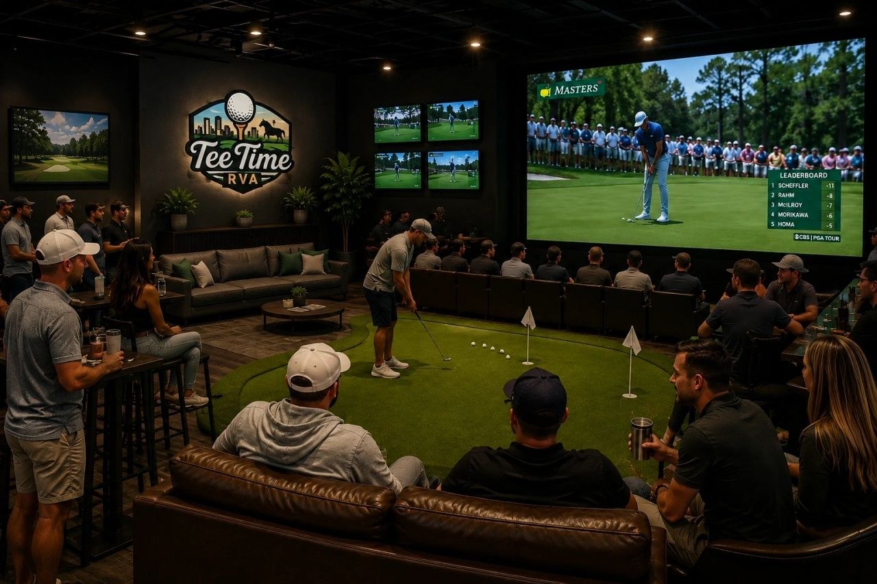 Group of guests at Tee Time RVA watching golf on the big screen while a player putts on the indoor green